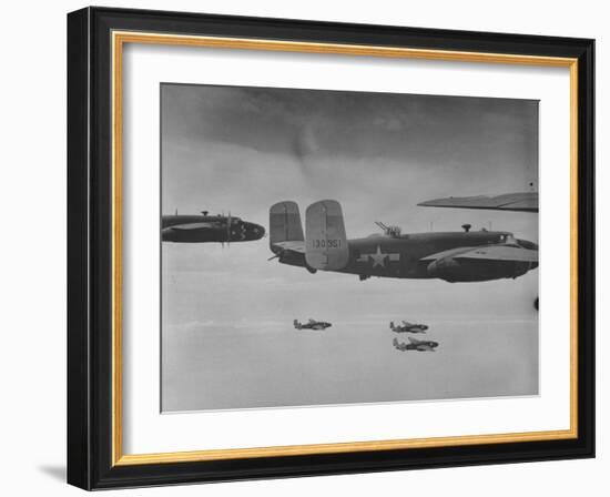 Flight of American B-25 Mitchell Bombers Enroute to a Bombing Mission over the Port of Madang-Myron Davis-Framed Photographic Print