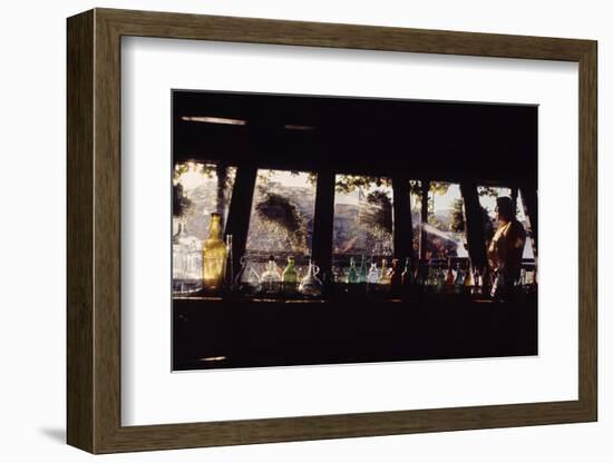 Floating-Home Owner Warren Owen Fonslor Watering the Hanging Plants, Sausalito, CA, 1971-Michael Rougier-Framed Photographic Print