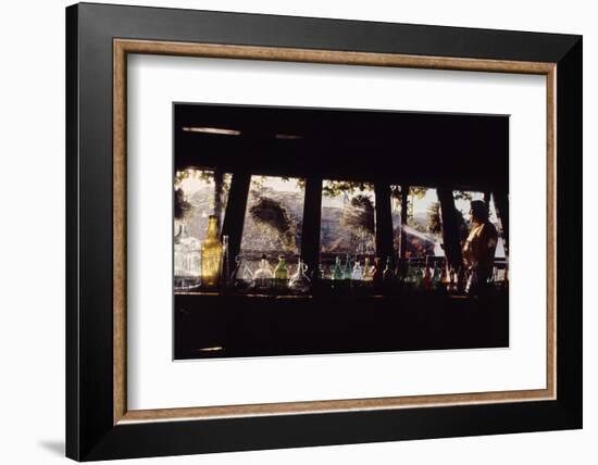 Floating-Home Owner Warren Owen Fonslor Watering the Hanging Plants, Sausalito, CA, 1971-Michael Rougier-Framed Photographic Print