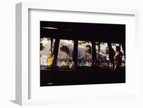 Floating-Home Owner Warren Owen Fonslor Watering the Hanging Plants, Sausalito, CA, 1971-Michael Rougier-Framed Photographic Print