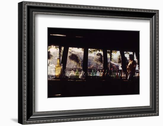 Floating-Home Owner Warren Owen Fonslor Watering the Hanging Plants, Sausalito, CA, 1971-Michael Rougier-Framed Photographic Print