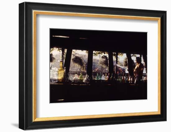 Floating-Home Owner Warren Owen Fonslor Watering the Hanging Plants, Sausalito, CA, 1971-Michael Rougier-Framed Photographic Print