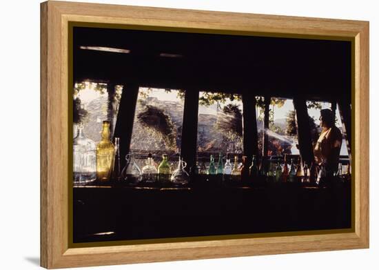 Floating-Home Owner Warren Owen Fonslor Watering the Hanging Plants, Sausalito, CA, 1971-Michael Rougier-Framed Premier Image Canvas