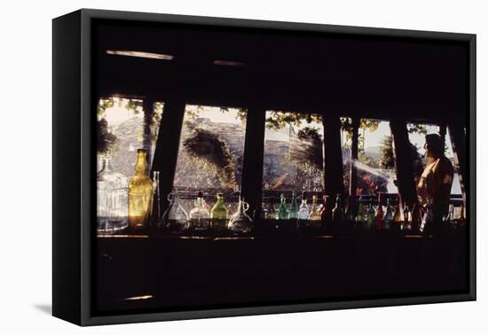 Floating-Home Owner Warren Owen Fonslor Watering the Hanging Plants, Sausalito, CA, 1971-Michael Rougier-Framed Premier Image Canvas