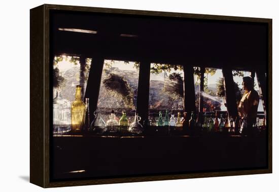 Floating-Home Owner Warren Owen Fonslor Watering the Hanging Plants, Sausalito, CA, 1971-Michael Rougier-Framed Premier Image Canvas