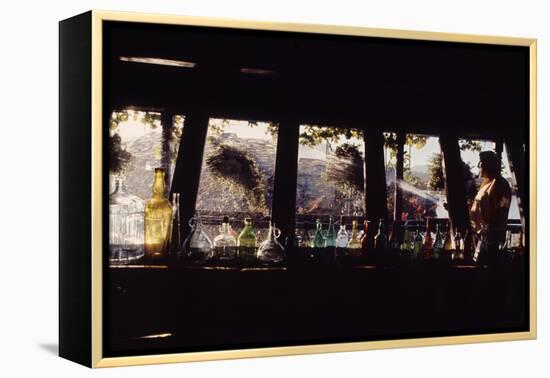 Floating-Home Owner Warren Owen Fonslor Watering the Hanging Plants, Sausalito, CA, 1971-Michael Rougier-Framed Premier Image Canvas