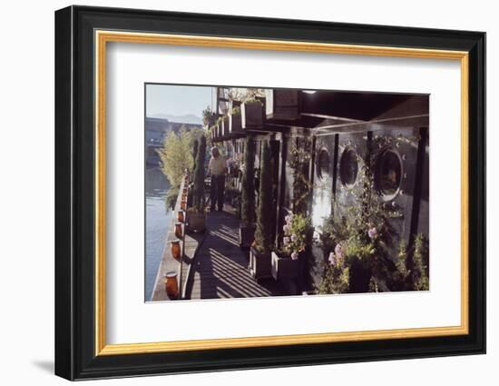 Floating-Home Owner Warren Owen Fonslor Waters the Plants on His Deck, Sausalito, CA, 1971-Michael Rougier-Framed Photographic Print