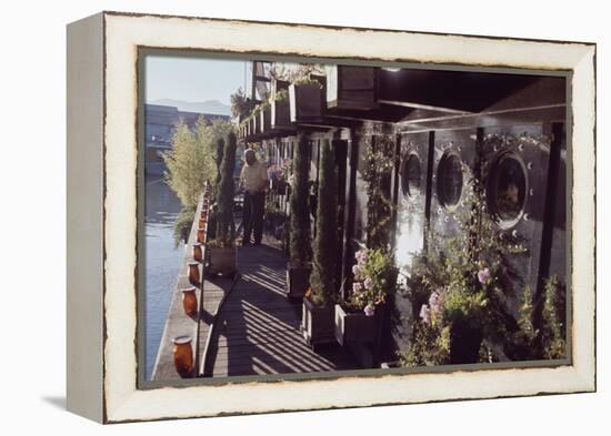 Floating-Home Owner Warren Owen Fonslor Waters the Plants on His Deck, Sausalito, CA, 1971-Michael Rougier-Framed Premier Image Canvas