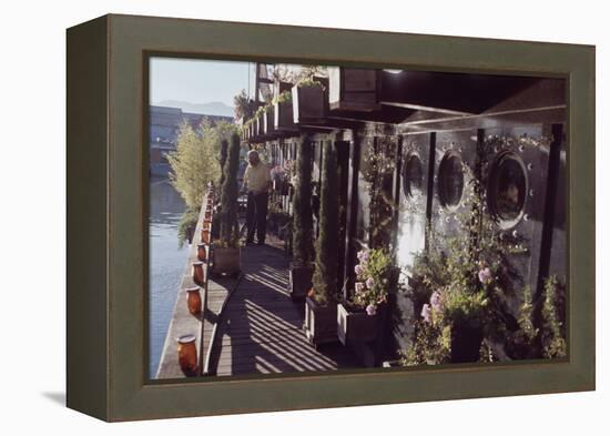 Floating-Home Owner Warren Owen Fonslor Waters the Plants on His Deck, Sausalito, CA, 1971-Michael Rougier-Framed Premier Image Canvas