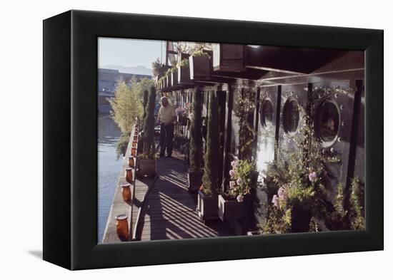 Floating-Home Owner Warren Owen Fonslor Waters the Plants on His Deck, Sausalito, CA, 1971-Michael Rougier-Framed Premier Image Canvas