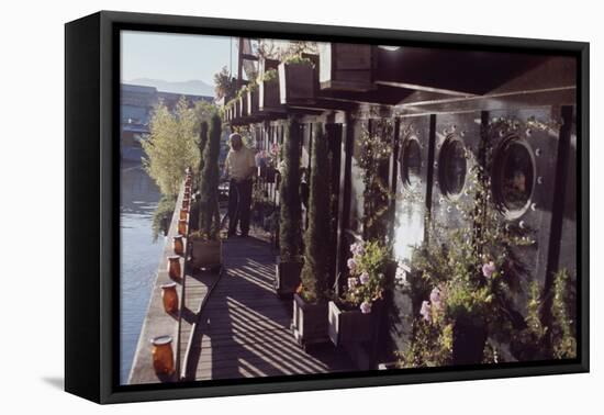 Floating-Home Owner Warren Owen Fonslor Waters the Plants on His Deck, Sausalito, CA, 1971-Michael Rougier-Framed Premier Image Canvas