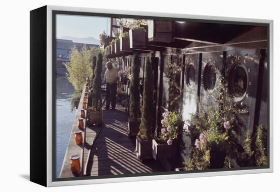 Floating-Home Owner Warren Owen Fonslor Waters the Plants on His Deck, Sausalito, CA, 1971-Michael Rougier-Framed Premier Image Canvas