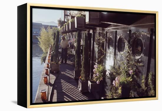 Floating-Home Owner Warren Owen Fonslor Waters the Plants on His Deck, Sausalito, CA, 1971-Michael Rougier-Framed Premier Image Canvas