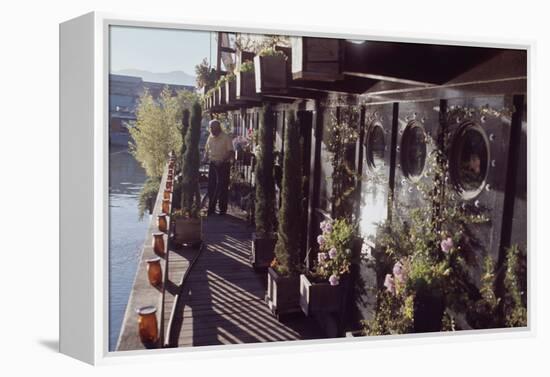 Floating-Home Owner Warren Owen Fonslor Waters the Plants on His Deck, Sausalito, CA, 1971-Michael Rougier-Framed Premier Image Canvas