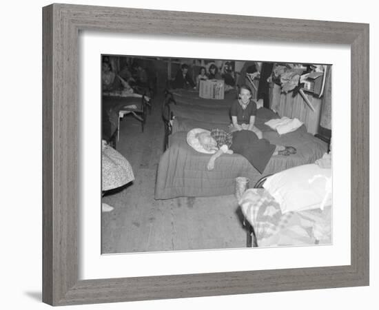 Flood refugees in a factory used by the Red Cross as a relief station in Mayfield, Kentucky, 1937-Walker Evans-Framed Photographic Print