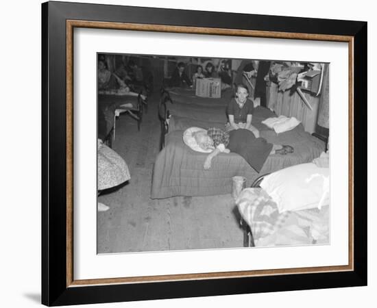 Flood refugees in a factory used by the Red Cross as a relief station in Mayfield, Kentucky, 1937-Walker Evans-Framed Photographic Print