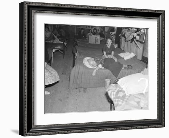 Flood refugees in a factory used by the Red Cross as a relief station in Mayfield, Kentucky, 1937-Walker Evans-Framed Photographic Print