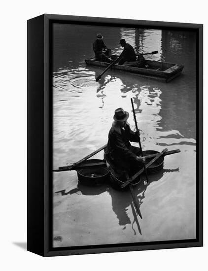Flood Victim Paddling Boat Fashioned Out of Four Washtubs in the Flood Waters of Mississippi River-Margaret Bourke-White-Framed Premier Image Canvas