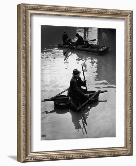 Flood Victim Paddling Boat Fashioned Out of Four Washtubs in the Flood Waters of Mississippi River-Margaret Bourke-White-Framed Photographic Print