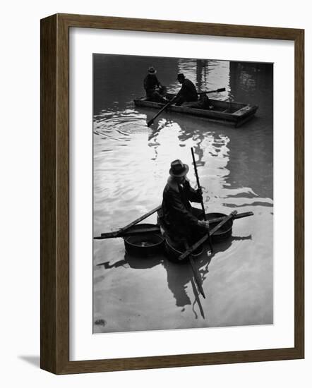 Flood Victim Paddling Boat Fashioned Out of Four Washtubs in the Flood Waters of Mississippi River-Margaret Bourke-White-Framed Photographic Print