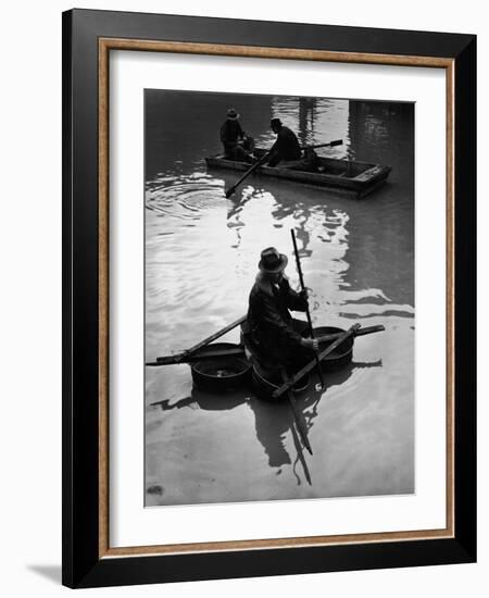 Flood Victim Paddling Boat Fashioned Out of Four Washtubs in the Flood Waters of Mississippi River-Margaret Bourke-White-Framed Photographic Print