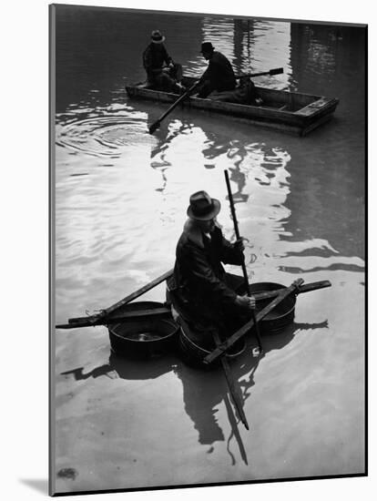 Flood Victim Paddling Boat Fashioned Out of Four Washtubs in the Flood Waters of Mississippi River-Margaret Bourke-White-Mounted Photographic Print