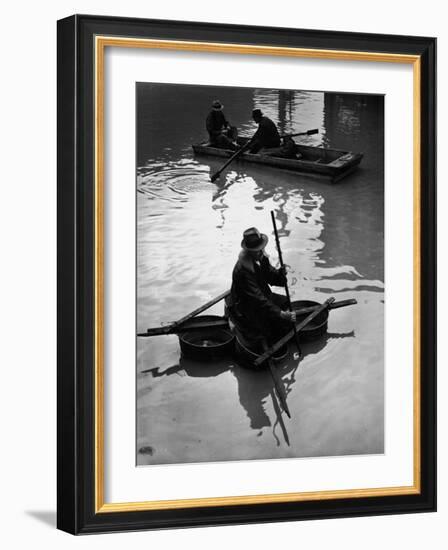 Flood Victim Paddling Boat Fashioned Out of Four Washtubs in the Flood Waters of Mississippi River-Margaret Bourke-White-Framed Photographic Print