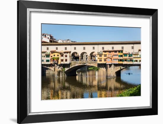 Florence, Florence Province, Tuscany, Italy. Sculler passing under the Ponte Vecchio, or Old Bri...-null-Framed Photographic Print