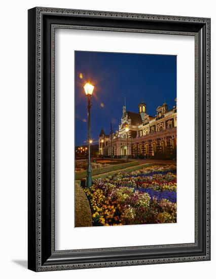 Flower garden and historic Railway Station at night, Dunedin, South Island, New Zealand-David Wall-Framed Photographic Print