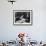 Flower Girl Janet Auchincloss Holding Up a Wedge of Wedding Cake for Bridegroom Sen. John Kennedy-Lisa Larsen-Framed Photographic Print displayed on a wall