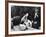 Flower Girl Janet Auchincloss Holding Up a Wedge of Wedding Cake for Bridegroom Sen. John Kennedy-Lisa Larsen-Framed Photographic Print