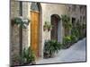 Flower Pots and Potted Plants Decorate a Narrow Street in Tuscan Village, Pienza, Italy-Dennis Flaherty-Mounted Photographic Print