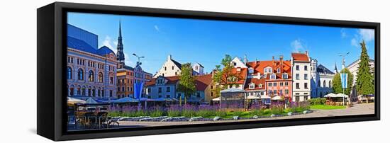 Flowers in a Garden with Buildings in the Background, Riga, Latvia-null-Framed Stretched Canvas