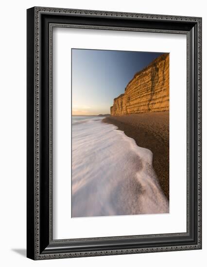 Foam on beach below cliffs at Burton Bradstock, Dorset, UK-Ross Hoddinott-Framed Photographic Print