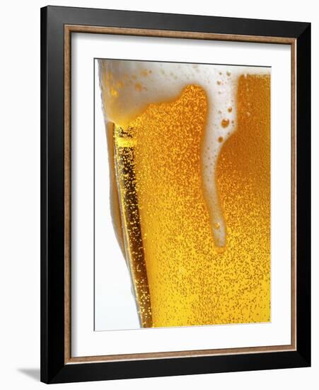 Foam Pouring over Edge of Glass of Light Beer-Brenda Spaude-Framed Photographic Print