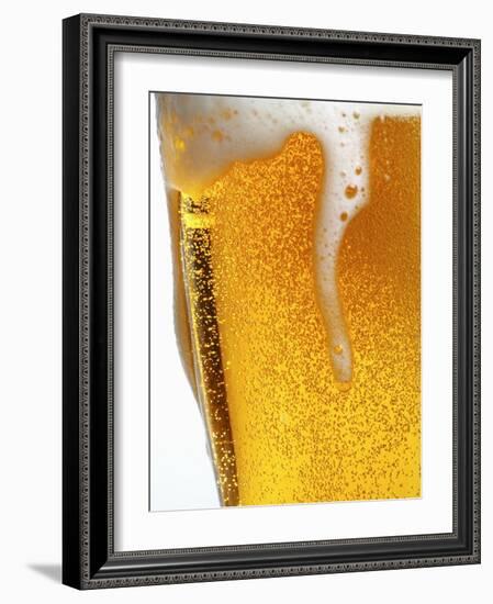 Foam Pouring over Edge of Glass of Light Beer-Brenda Spaude-Framed Photographic Print