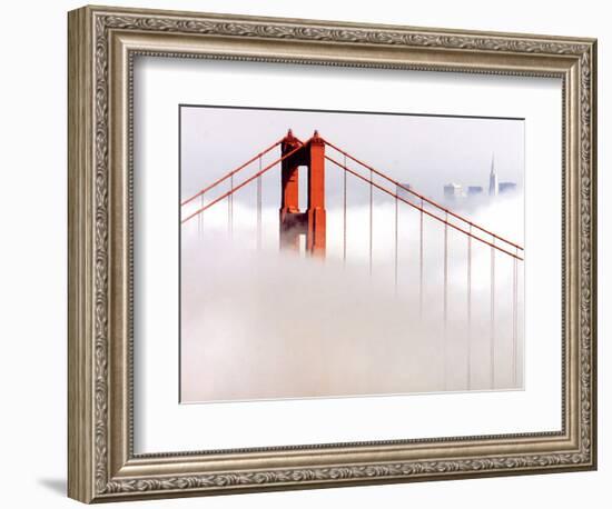 Fog Swirls and Covers All of Golden Gate Bridge Save the North Tower and the Tips of Skyscrapers-null-Framed Photographic Print