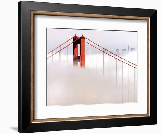 Fog Swirls and Covers All of Golden Gate Bridge Save the North Tower and the Tips of Skyscrapers--Framed Photographic Print