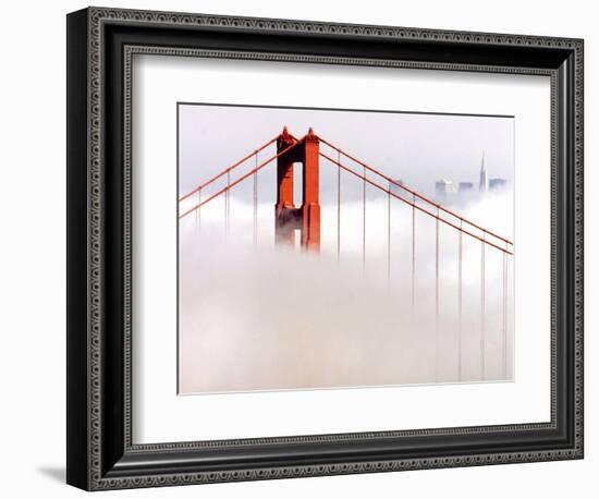 Fog Swirls and Covers All of Golden Gate Bridge Save the North Tower and the Tips of Skyscrapers--Framed Photographic Print