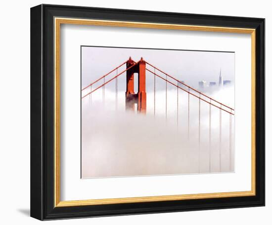 Fog Swirls and Covers All of Golden Gate Bridge Save the North Tower and the Tips of Skyscrapers--Framed Photographic Print