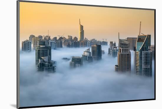 Foggy sunrise with Dubai Marina's skyscrapers towering over the low clouds, Dubai, United Arab Emir-Stefano Politi Markovina-Mounted Photographic Print