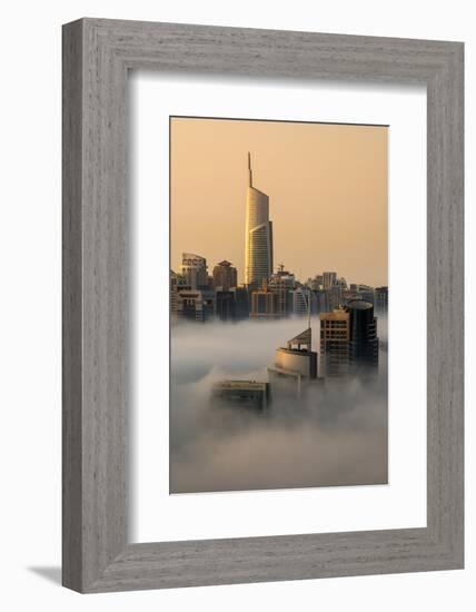 Foggy sunrise with Dubai Marina's skyscrapers towering over the low clouds, Dubai, United Arab Emir-Stefano Politi Markovina-Framed Photographic Print