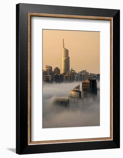 Foggy sunrise with Dubai Marina's skyscrapers towering over the low clouds, Dubai, United Arab Emir-Stefano Politi Markovina-Framed Photographic Print