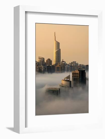 Foggy sunrise with Dubai Marina's skyscrapers towering over the low clouds, Dubai, United Arab Emir-Stefano Politi Markovina-Framed Photographic Print