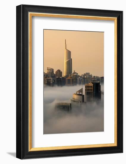 Foggy sunrise with Dubai Marina's skyscrapers towering over the low clouds, Dubai, United Arab Emir-Stefano Politi Markovina-Framed Photographic Print