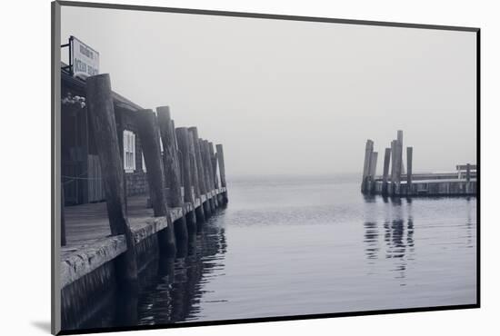 Foggy view of the docks at the ferry at Ocean Beach Fire Island NY-null-Mounted Photo