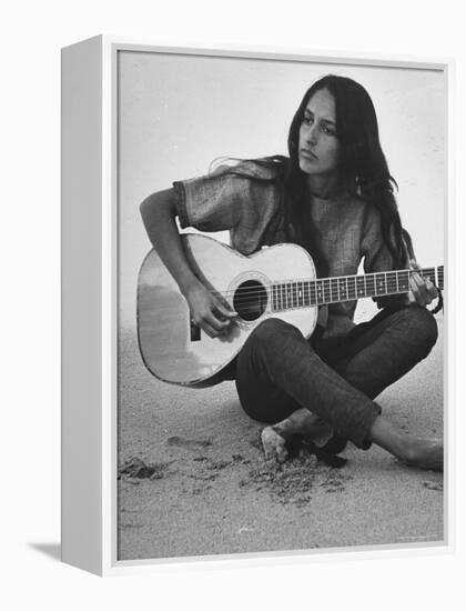 Folk Singer Joan Baez Strumming Her Guitar on the Beach Near Her Home-Ralph Crane-Framed Premier Image Canvas