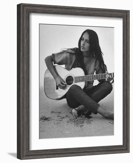Folk Singer Joan Baez Strumming Her Guitar on the Beach Near Her Home-Ralph Crane-Framed Premium Photographic Print