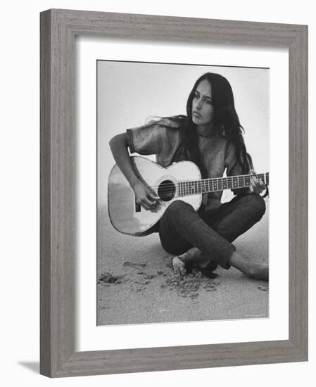 Folk Singer Joan Baez Strumming Her Guitar on the Beach Near Her Home-Ralph Crane-Framed Premium Photographic Print