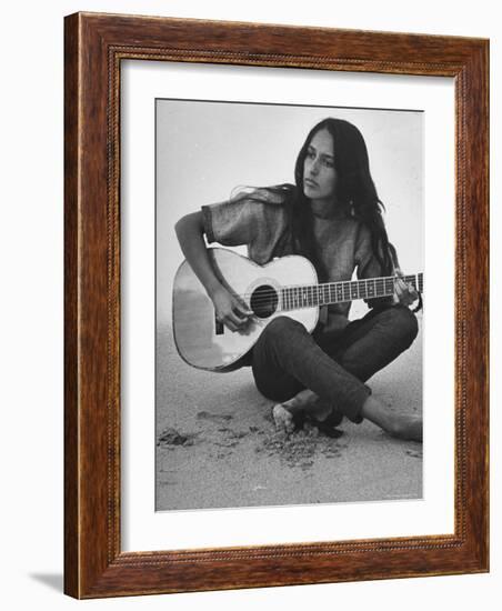 Folk Singer Joan Baez Strumming Her Guitar on the Beach Near Her Home-Ralph Crane-Framed Premium Photographic Print